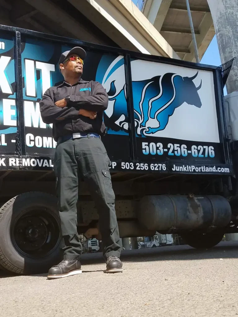 Dupree Carter standing in front of Junk It Junk Removal truck