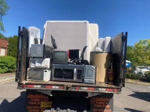 household furniture and electronics in truck